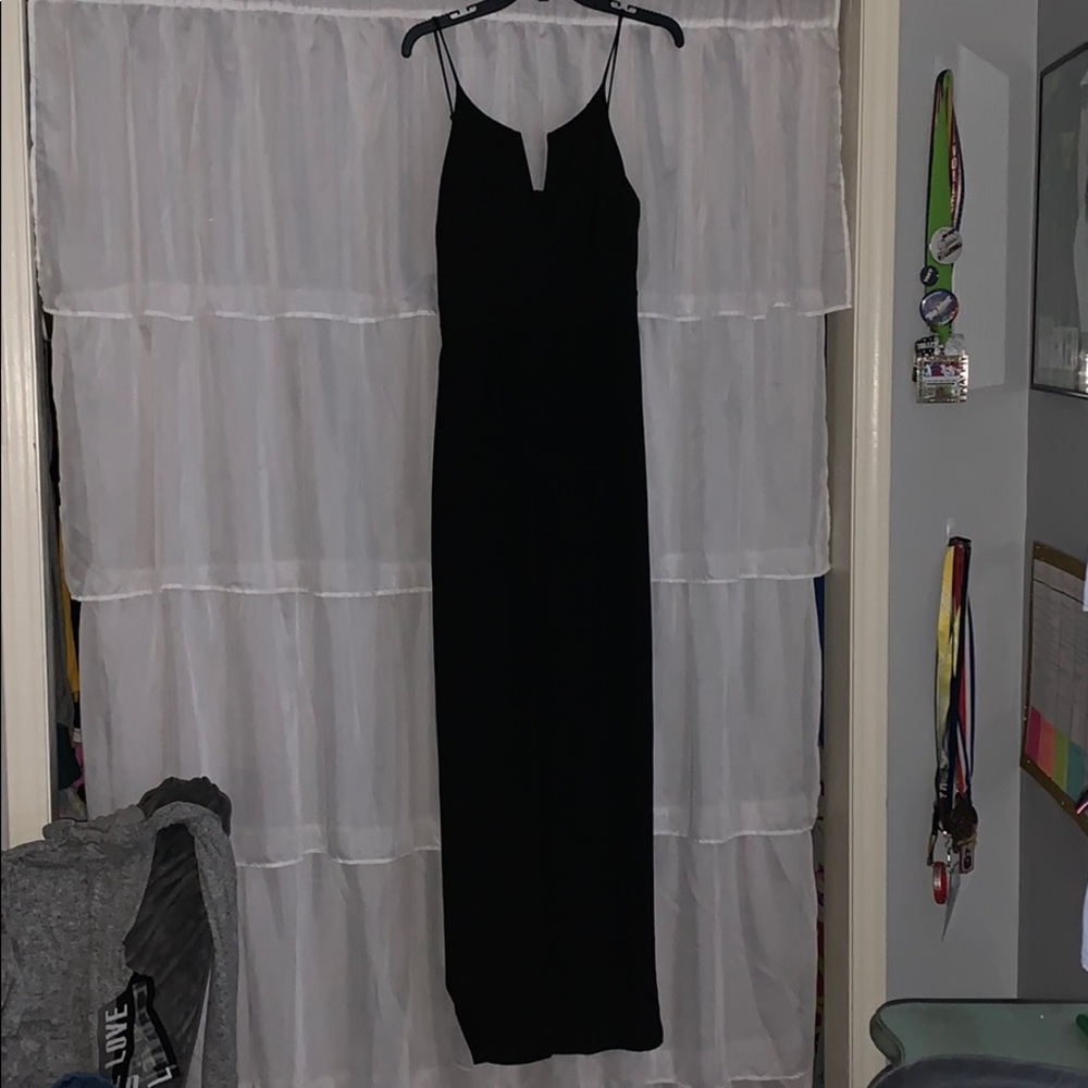 Black romper/jump suit.